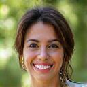 Sarah P., a smiling educator, radiating warmth.