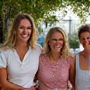 Group of women laughing at a local Austin event.